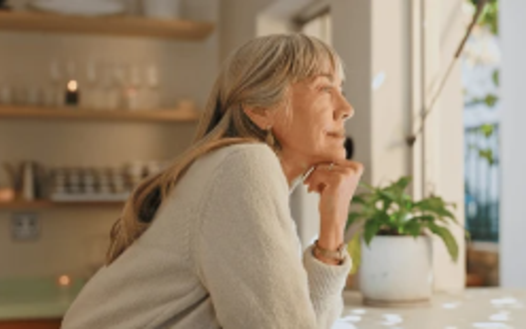 Woman looking out window